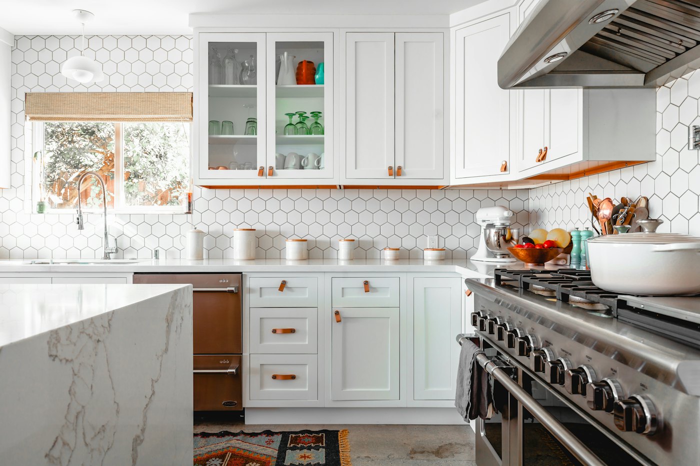 White shaker-style kitchen with hexagon tile backsplash